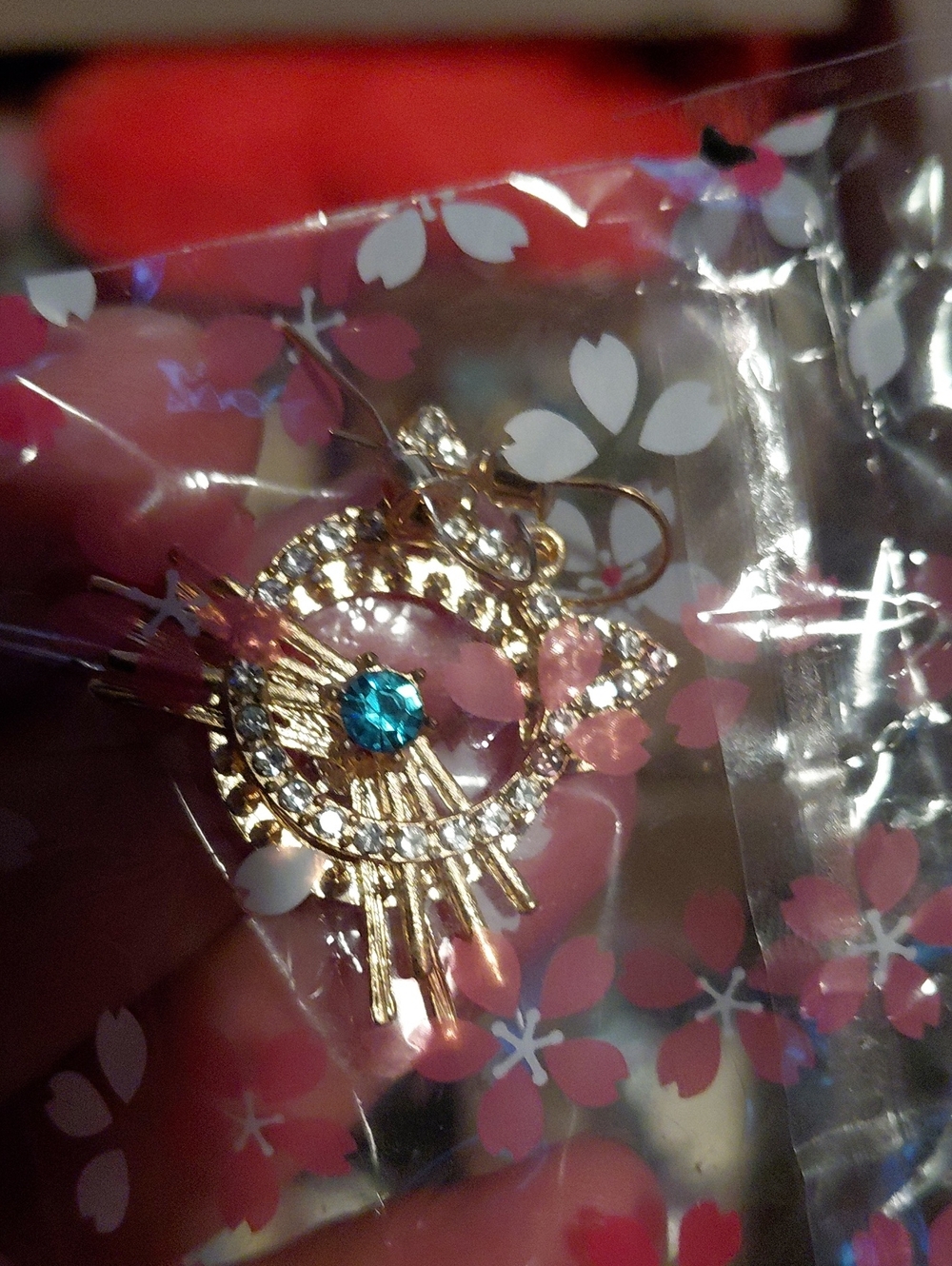 Gold-Tone Hello Kitty Earrings with Teal Center